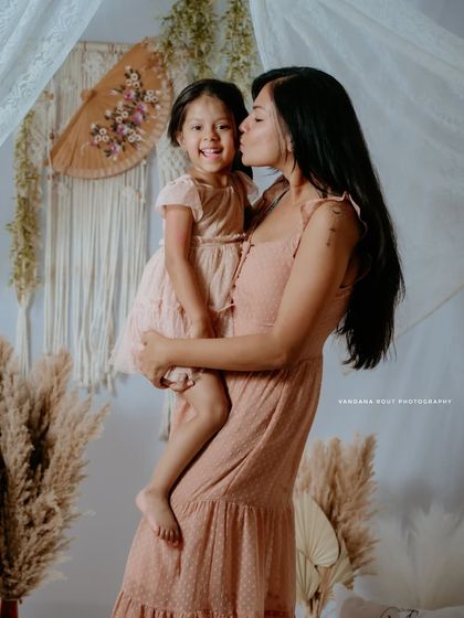 A sweet kiss on the cheek. This tender moment between mother and daughter is a perfect example of the love I aim to capture in my family sessions.