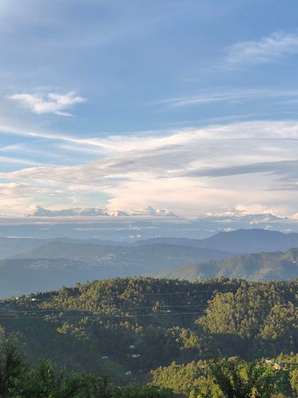 The majestic snow-capped peaks of the Himalayas as seen from the retreat. This breathtaking view is a daily reminder of the grandeur and scale we can aspire to in our writing.