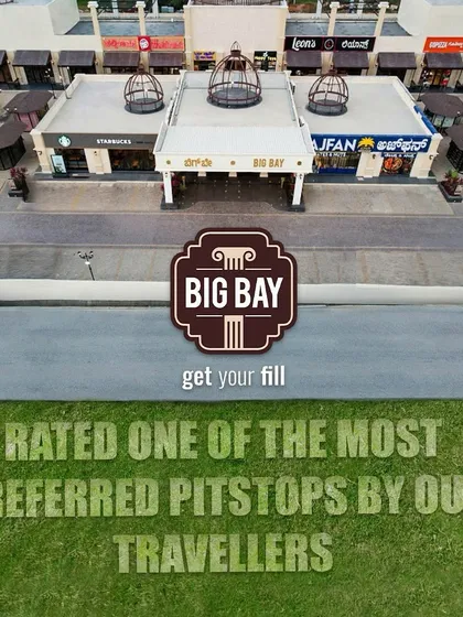 An aerial view of our main building with a graphic overlay stating we are rated one of the most preferred pitstops by our travelers.
