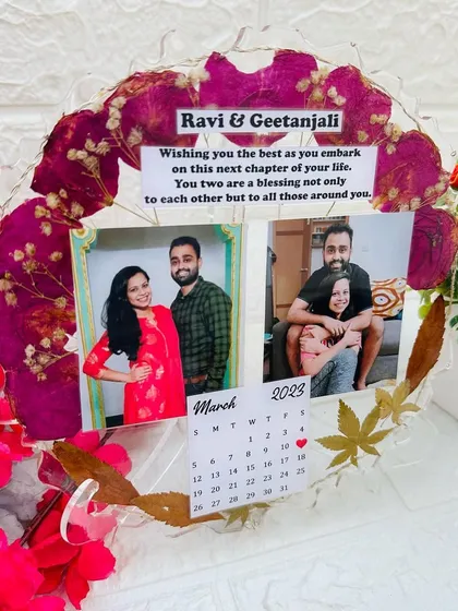 A clear, frontal view of the frame without lights, focusing on the photos and personalized elements.