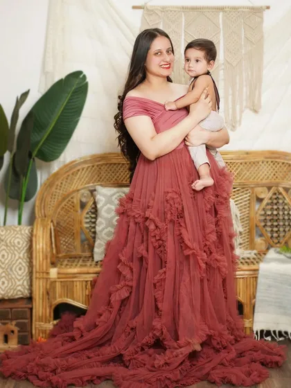 A stunning portrait of a mother in one of our client gowns, holding her baby. These sessions are perfect for celebrating motherhood.
