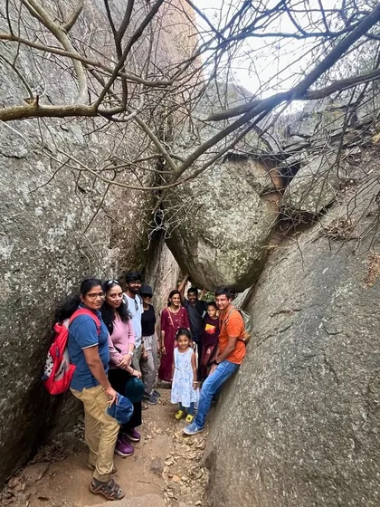 Navigating the narrow rock passages on the way to the top of Huthridurga. The trek is full of small, exciting challenges.