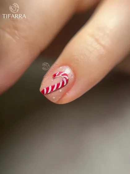 A sweet, hand-painted candy cane on a sparkling, translucent base, perfect for a subtle festive touch.