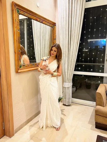 Another moment from our Diwali celebration at home. The simplicity of a white saree can be so elegant.