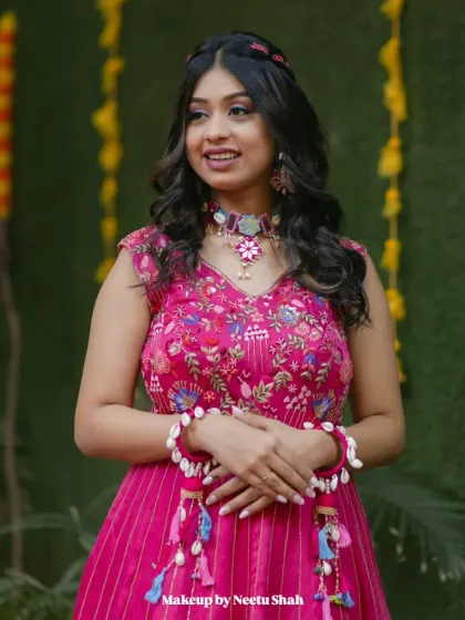 A full-length view of the vibrant pink Haldi gown. The overall look is youthful, modern, and full of joy.