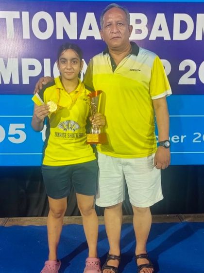 **A Golden Moment for a National Champion.** Divyanshi, a National Champion, with her well-deserved trophy and gold medal, representing her hard work and the academy's commitment to excellence.