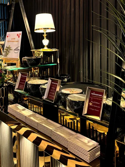 An identical view of our sophisticated Teppanyaki station, highlighting the clean lines and premium setup. Our passion for excellence ensures we leave a lasting impression on you and your guests.
