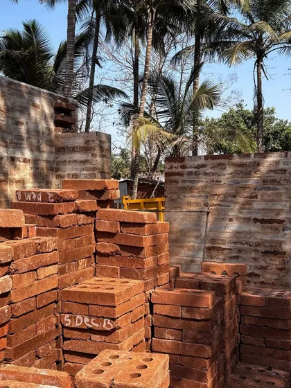 Stacks of freshly made stabilized earth blocks are ready for use at the Aadi Villa site. This project, in collaboration with Solarpunk, is a step towards a more sustainable future for construction in India.