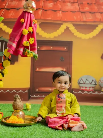 Celebrating the Maharashtrian new year with a Gudi Padwa themed shoot. This little one is dressed in a traditional kurta and sits beside a beautifully decorated Gudi.