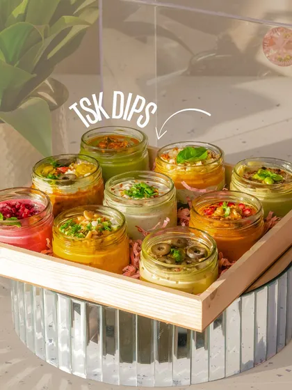 A beautiful tray of my signature dips in jars, ready for a party. This is the perfect, colourful addition to any grazing table.