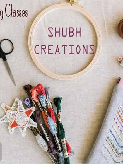 My hand embroidery classes for beginners provide you with all the tools you need to start. This flat lay shows the essentials: an embroidery hoop, colorful threads, scissors, and a sample project.