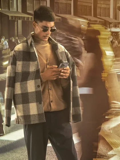 Here, the subject is perfectly integrated into a busy projected street scene. I demonstrate how to use long exposure and a focused key light to make the model stand out while the background shows motion and life.