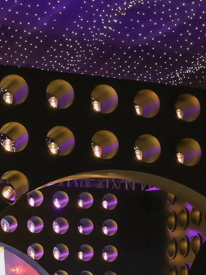 A closer look at the architectural details of the bar area, with its curved lines and walls of light.