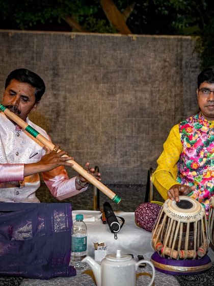 Live classical music, featuring a flutist and a tabla player, added a soulful ambiance to our 'Forgotten Greens' dinner event.