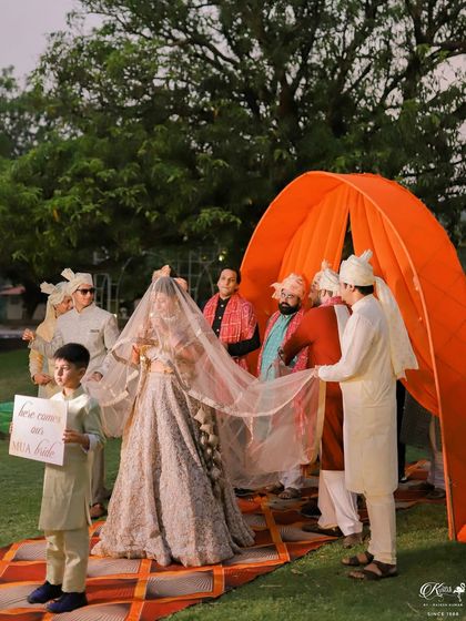 The bride's entrance, with her brothers and a young page boy leading the way.