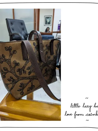A lovely gift for an aunt from our patron Mahitha. This Little Lazy Bailey tote features our Gond art, with a 'tree of life' motif hand-painted on a metallic Bronze leather, making it a truly special and artistic piece.