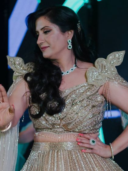 The mother of the bride performing with grace and elegance. We choreograph solos and group dances for parents too.