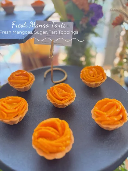 These Fresh Mango Tarts are a celebration of the season. Each tartlet is filled with a creamy base and topped with beautifully arranged fresh mango, shaped like a rose.