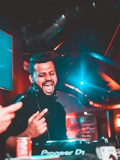 This is me in my element. That moment when the beat drops, the crowd roars, and everything just clicks. I live for creating these small moments of pure energy on the dance floor.