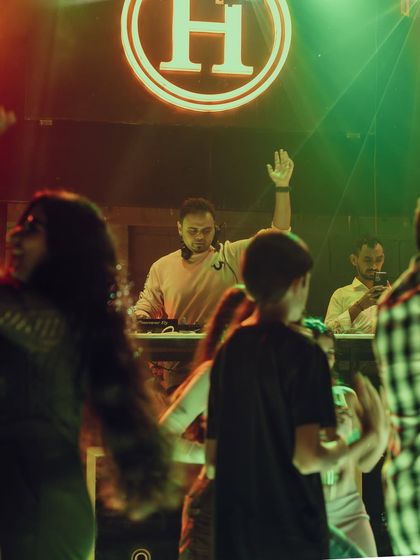 A shot of me with my hand in the air, connecting with the dancers.