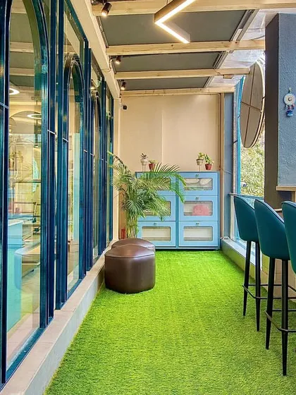 The studio balcony offers a place to catch your breath and enjoy a view of the neighborhood. It is a little pocket of fresh air and calm.