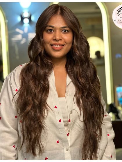 The client's smile says it all. This luminous brown shine is designed to turn heads and boost confidence.