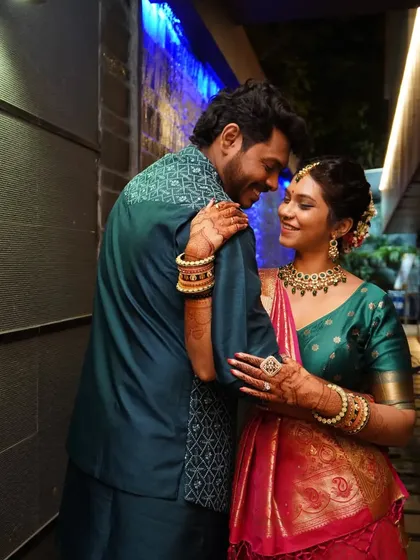Another romantic embrace, highlighting the beautiful traditional attire of the couple.