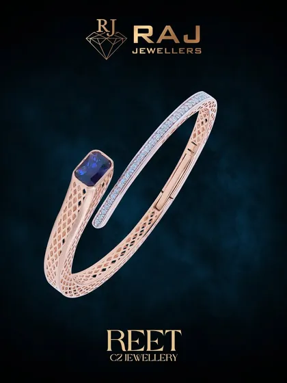 This modern rose gold kada showcases a sleek, open design, culminating in a striking blue gemstone set against a backdrop of sparkling CZ stones. Its architectural form and detailed meshwork offer a perfect blend of contemporary style and classic elegance.