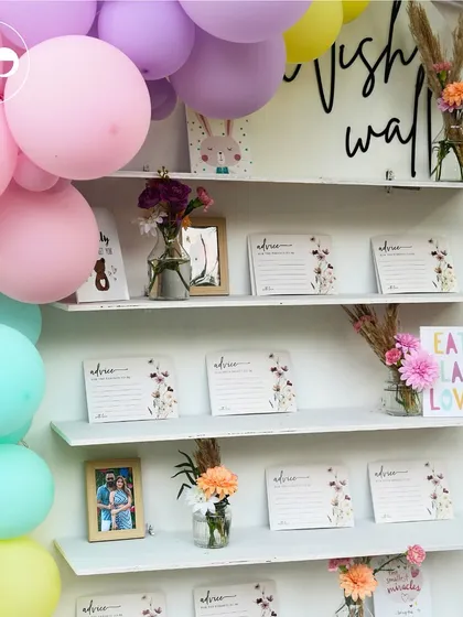 I love creating interactive stations that engage guests and create lasting keepsakes. This beautiful wish wall, framed by a pastel balloon arch, invited friends and family to leave heartfelt advice and wishes for the parents to be.