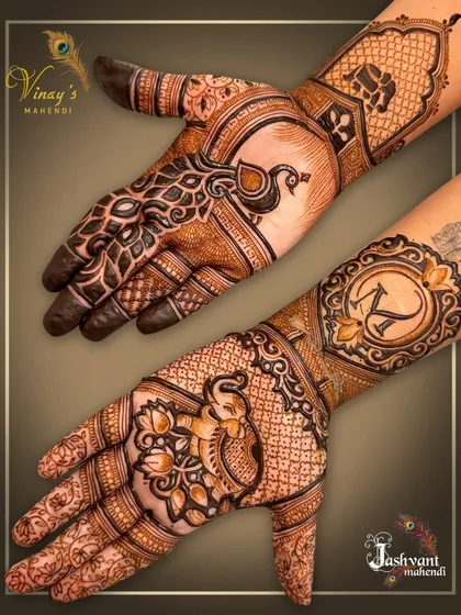 Another view of the personalized design, showing the peacock and initial 'K' on separate hands.