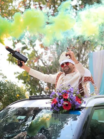 The groom's baraat in full swing. I equipped him with color smoke guns to make his procession even more epic and fun for everyone involved.