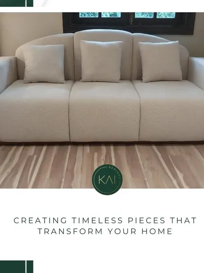 A beautifully crafted sofa with a scalloped back and soft, neutral upholstery. This piece combines a gentle, curved silhouette with a minimalist aesthetic, offering a timeless design that provides both comfort and style.