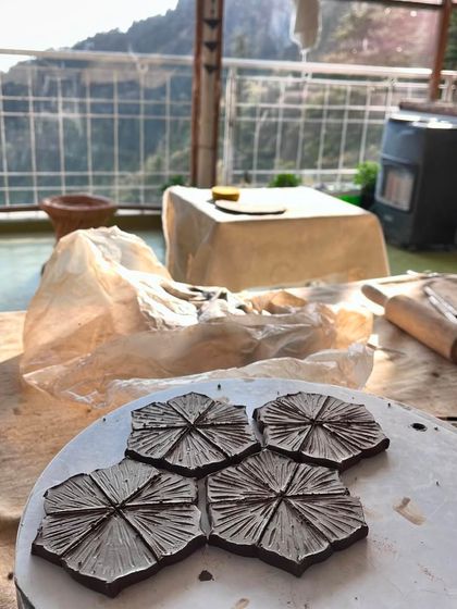The view from the pottery studio, with my freshly made clay coasters drying in the sun. The mountain scenery was the perfect inspiration.