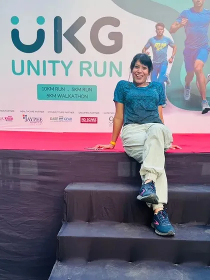 A moment of relaxation on the event stage at the UKG Unity Run. I create an environment where my team and participants can feel accomplished and at ease after a great event.