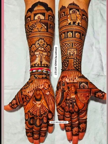 A majestic bridal design with portraits, elephants, and peacocks, creating a royal wedding theme.