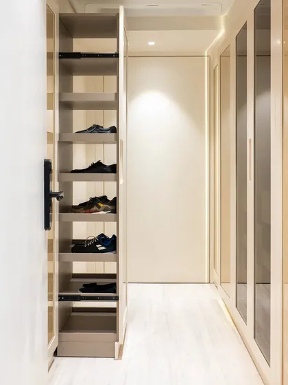 A pull-out shoe rack is a wonderfully efficient way to store and access your footwear. This tall, narrow unit makes use of vertical space, keeping shoes organized and off the floor.