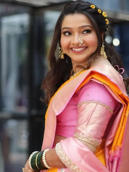 A soft and dreamy look for her pre-wedding ceremony. The makeup is minimal, with a focus on fresh skin and a gentle smile.