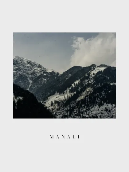 A minimalist shot focusing solely on the majestic, snow capped mountains of Manali. This image serves as a beautiful establishing shot, setting the scene for the destination wedding story.