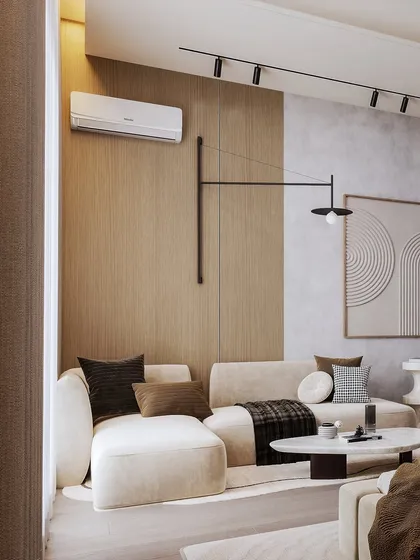 A shot of the cozy seating area in the bedroom, with a sculptural lamp and abstract art creating a modern, relaxed vibe.