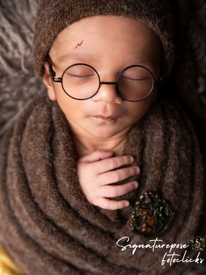 A peaceful, sleeping portrait of the baby who lived. The soft lighting and cozy wrap ensure the baby is comfortable throughout the magical session.