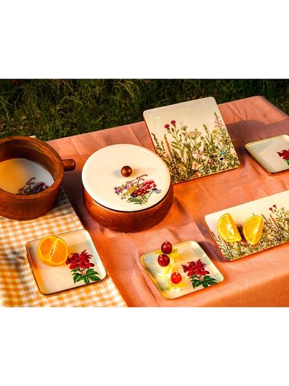 The full outdoor tablescape, captured from a different angle. The warm tones and natural setting create a very aspirational lifestyle image.