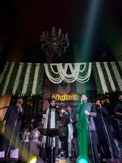 A wide view of our Sufi setup on stage, with the full band including tabla, dholak, and violin, creating a rich, authentic sound.