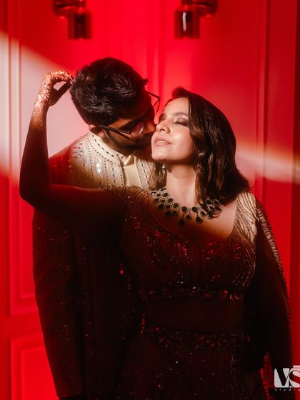 Using dramatic red lighting, we captured this intimate and passionate portrait of Archana and Akhil during their sangeet night. It’s a moody, stylish shot that showcases a different side of their connection.
