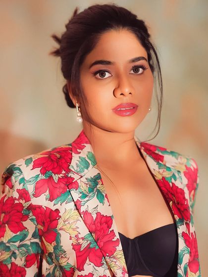 A direct and powerful portrait of Karunya. Her makeup is clean and striking, with a focus on her beautiful eyes.