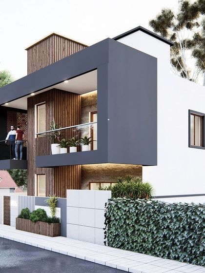 This design showcases a bold, cantilevered block that creates a dramatic floating effect for the first-floor balcony. The combination of white walls, wood paneling, and a green hedge provides a clean and modern aesthetic.