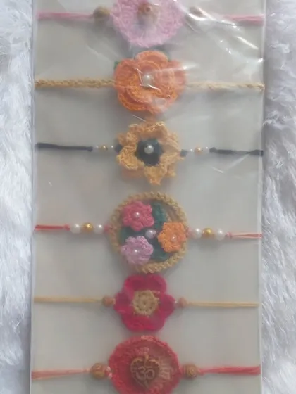 A packaged set of my custom crochet rakhis, ready to be gifted.