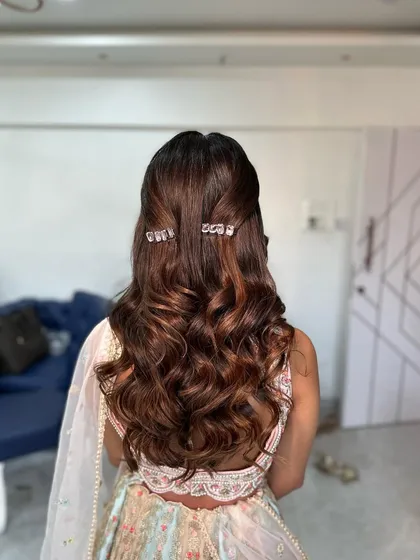 The back view of this delicate half-updo. The clips are just enough to add a bit of sparkle without overpowering the look.