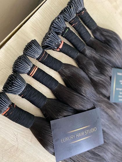 Another shot of our premium I-Tip extensions, neatly bundled and displaying our Luxury Hair Studio branding.