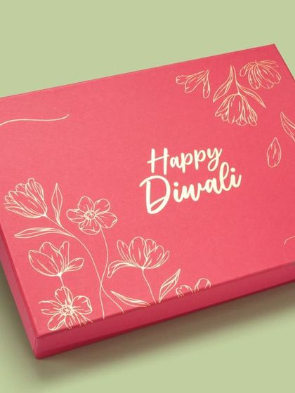 A pink version of the "Happy Diwali" gift box. We provide consistent shots for all color variations of a product.
