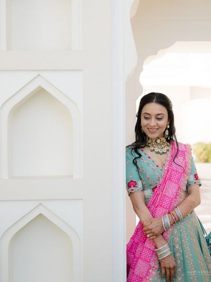 Peeking out from a doorway. I love using architectural elements to create playful and interesting compositions for bridal portraits.